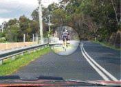 category traffic-lights-lanes - When the road is marked this way are you permitted to cross the lines to overtake the bicycle rider if the way forward is clear?